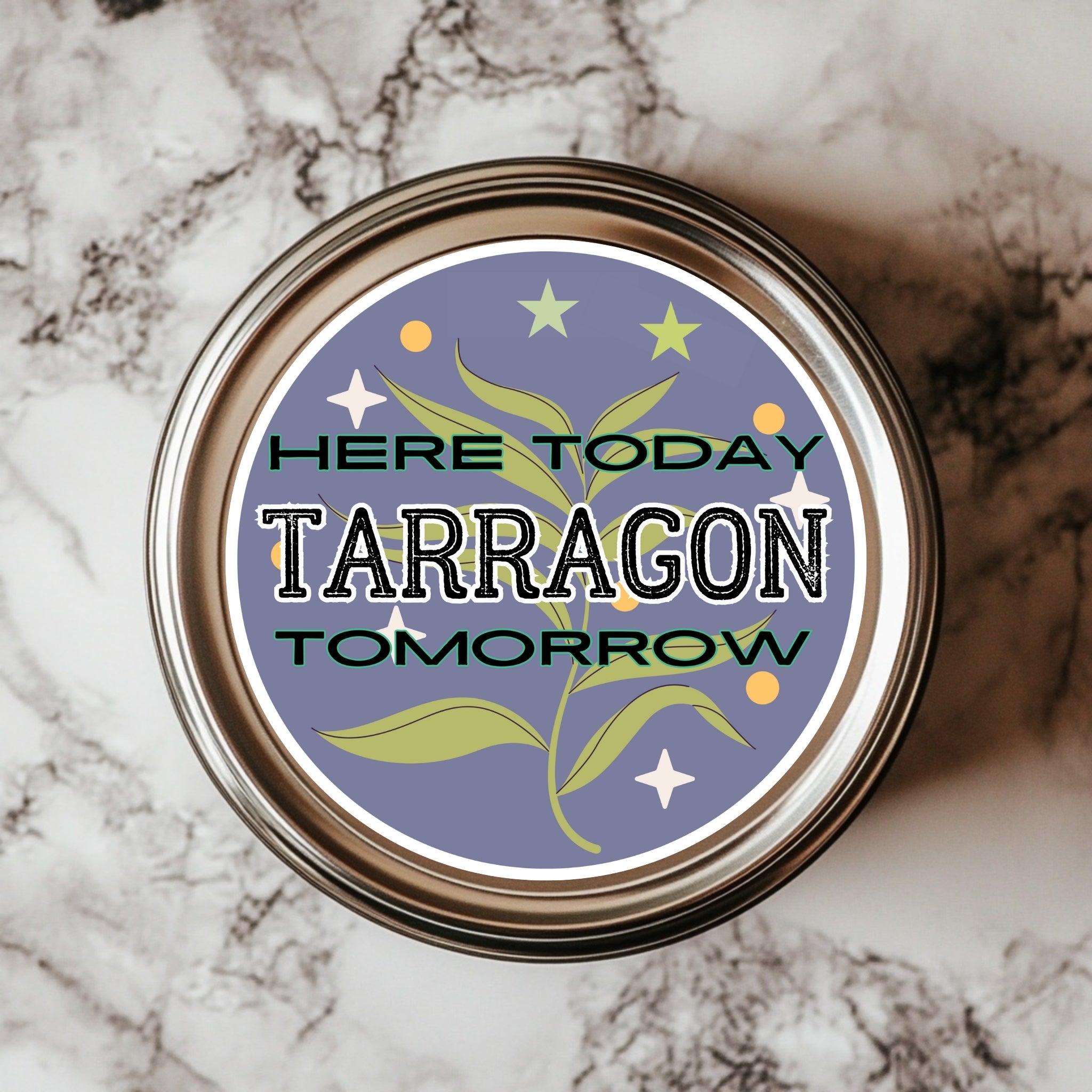A 3x3 inch round sticker with the text 'HERE TODAY TARRAGON TOMORROW' on a background featuring a plant and stars, placed on a marble surface.