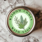 Wisdom Comes With Sage Sticker showcasing a vibrant botanical sage leaf design, perfect for decorating kitchens and gifts, crafted from 2.25" waterproof vinyl.