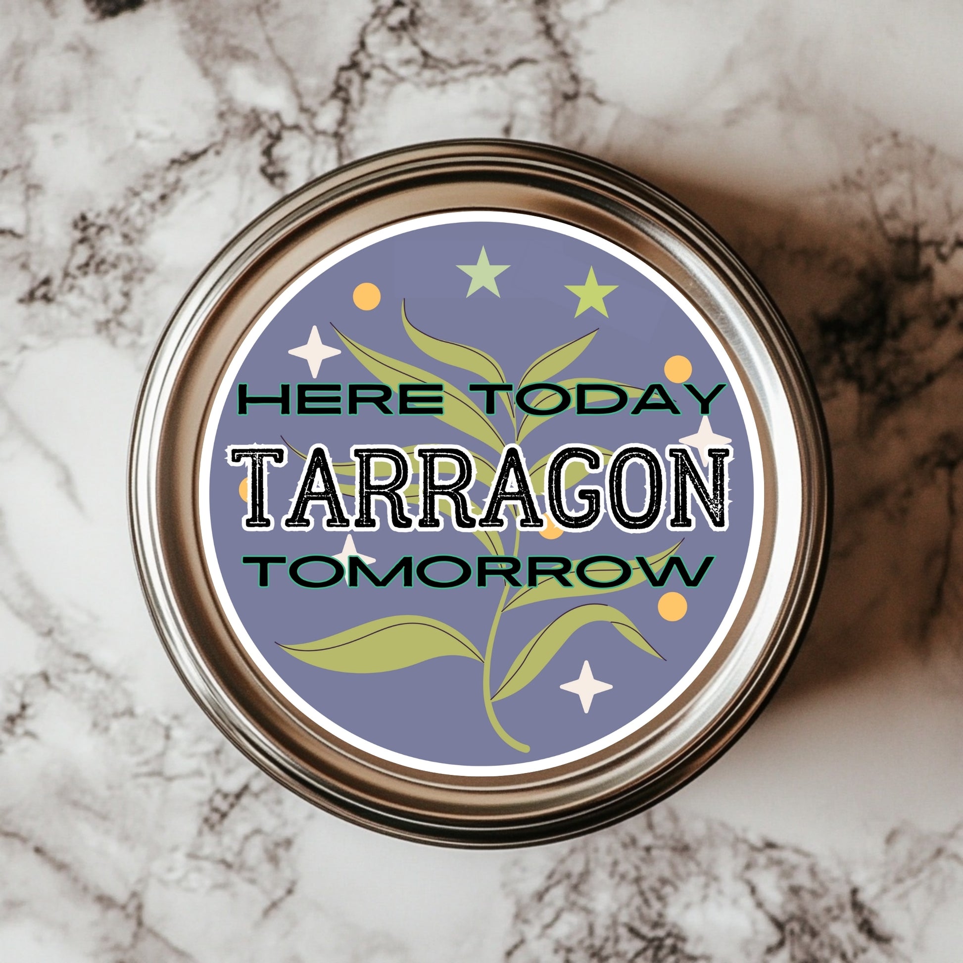 A 3x3 inch round sticker with the text 'HERE TODAY TARRAGON TOMORROW' on a background featuring a plant and stars, placed on a marble surface.