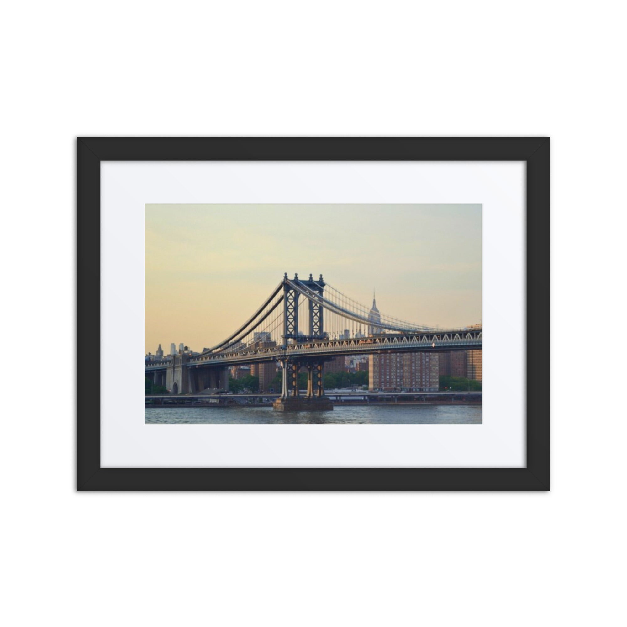Framed photograph of a bridge with a cityscape in the background