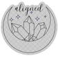 I Am Aligned Crystal sticker placed on a journal, highlighting its durable waterproof vinyl material and enchanting crescent moon motif.