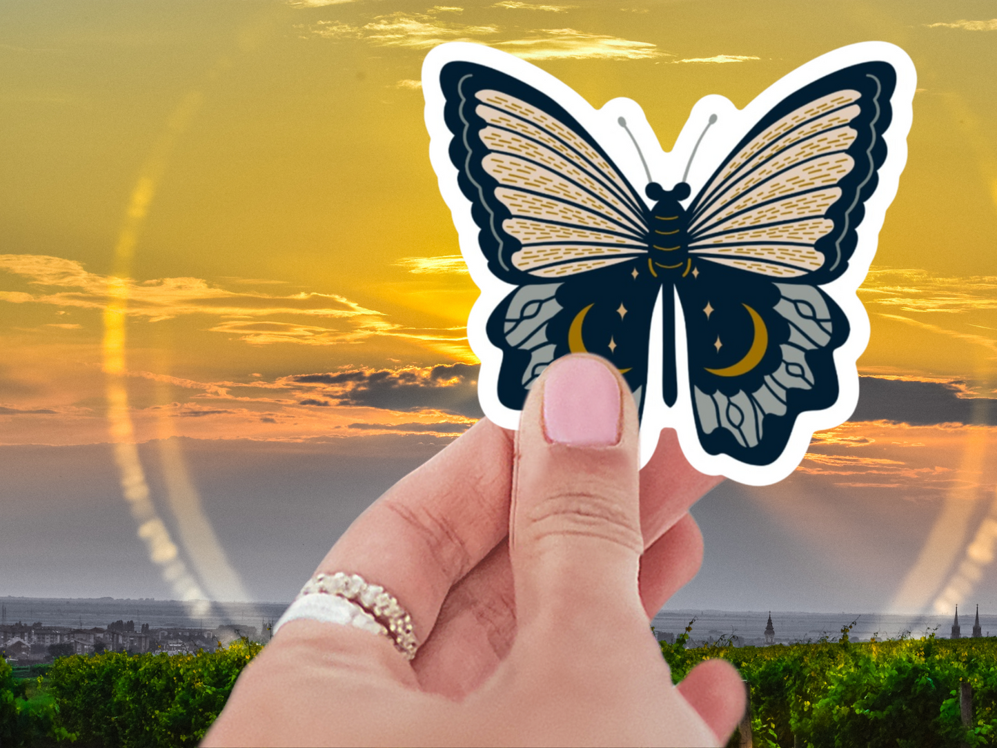 Black Moonlit Butterfly Sticker showcased on a laptop, demonstrating the durable and colorful black butterfly sticker, perfect for stylish decoration.