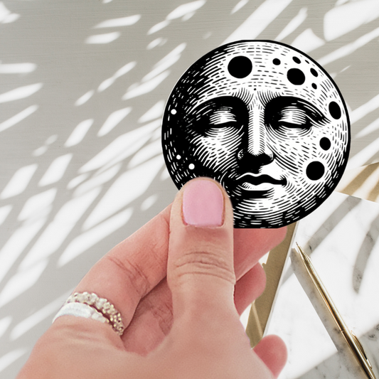 Celestial Moon Face Vinyl Sticker 2x2 featuring a colorful, intricate moon design. This waterproof and durable celestial moon sticker adds a magical touch to any space.